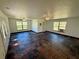 Spacious living area with unique flooring, multiple windows and ceiling fans to provide comfort and style at 472 Rosalia Dr, Sanford, FL 32771