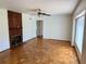 Spacious living room featuring a brick fireplace, hardwood floors, and a ceiling fan at 472 Rosalia Dr, Sanford, FL 32771