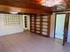 Open living room with built-in bookshelf, tile flooring, and ample space at 472 Rosalia Dr, Sanford, FL 32771
