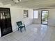 Enclosed patio with tiled floor and secure entrances, perfect for enjoying the outdoors safely at 472 Rosalia Dr, Sanford, FL 32771