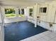 Enclosed sunroom with natural light, offering versatile space for relaxation or entertaining at 472 Rosalia Dr, Sanford, FL 32771