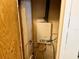 Compact utility closet housing an efficient tankless water heater for on-demand hot water at 472 Rosalia Dr, Sanford, FL 32771