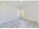 Bright bedroom with a window view and light gray flooring at 4914 Sw 147Th Loop, Ocala, FL 34473