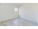 Bright bedroom with white walls, light gray flooring and a window allowing natural light at 4914 Sw 147Th Loop, Ocala, FL 34473