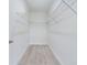 Walk in closet with wire shelving and light gray flooring at 4914 Sw 147Th Loop, Ocala, FL 34473