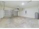 Spacious garage with block walls and a garage door at 4914 Sw 147Th Loop, Ocala, FL 34473