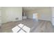 Sunlit living room showcasing the open layout and modern flooring at 4914 Sw 147Th Loop, Ocala, FL 34473