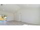 Spacious living area featuring modern floors, natural light, and access to outdoor spaces at 4914 Sw 147Th Loop, Ocala, FL 34473