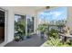 Relaxing balcony filled with potted plants, offering a serene outdoor space with city views at 5300 S Atlantic Ave # 7-301, New Smyrna Beach, FL 32169