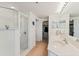 Elegant bathroom with dual sinks, walk-in shower, and a closet for ample storage at 5300 S Atlantic Ave # 7-301, New Smyrna Beach, FL 32169