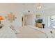 Bright bedroom with a large bed, glass block wall art, and sliding glass doors to the balcony at 5300 S Atlantic Ave # 7-301, New Smyrna Beach, FL 32169