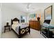 Comfortable bedroom with warm colors and a ceiling fan, perfect for relaxation and rest at 5300 S Atlantic Ave # 7-301, New Smyrna Beach, FL 32169