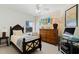 Comfortable bedroom with warm colors and a ceiling fan, perfect for relaxation and rest at 5300 S Atlantic Ave # 7-301, New Smyrna Beach, FL 32169