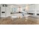 Bright kitchen with stainless steel appliances, granite countertops, white cabinetry, and ample counter space at 5300 S Atlantic Ave # 7-301, New Smyrna Beach, FL 32169