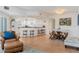 Bright and airy open concept living and dining space featuring tile flooring and a kitchen bar at 5300 S Atlantic Ave # 7-301, New Smyrna Beach, FL 32169