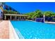 Resort-style swimming pool featuring a covered seating area and an inviting waterfall feature at 5300 S Atlantic Ave # 7-301, New Smyrna Beach, FL 32169