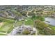 Overhead view of the country club with manicured greens, inviting fairways, and scenic landscaping at 6339 Coopers Green Ct, Orlando, FL 32819