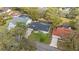 Aerial view of home featuring lush landscaping and a brick driveway at 6339 Coopers Green Ct, Orlando, FL 32819