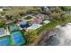Aerial view of community amenities featuring pool, tennis courts, playground, and beach volleyball at 6339 Coopers Green Ct, Orlando, FL 32819