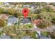 Aerial shot of the property showcasing its layout, enclosed pool, and landscaped surroundings at 6339 Coopers Green Ct, Orlando, FL 32819