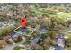 Aerial view of a home near a golf course, highlighted with property lines and a location marker at 6339 Coopers Green Ct, Orlando, FL 32819