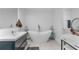 Luxurious bathroom featuring a standalone tub, modern vanity, and elegant fixtures at 6339 Coopers Green Ct, Orlando, FL 32819
