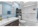 Modern bathroom features a sleek vanity, toilet and a shower with glass sliding doors at 6339 Coopers Green Ct, Orlando, FL 32819