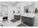 Bathroom featuring dual vanities, sleek cabinetry, and bright tile flooring at 6339 Coopers Green Ct, Orlando, FL 32819