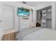 Comfortable bedroom featuring a TV, closet, and ample storage space at 6339 Coopers Green Ct, Orlando, FL 32819