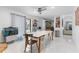 Bright dining room with tile floors, a view of the pool, and easy access to the kitchen at 6339 Coopers Green Ct, Orlando, FL 32819