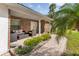 Charming front porch with stylish seating and attractive landscaping enhancing the home's curb appeal at 6339 Coopers Green Ct, Orlando, FL 32819