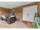 Welcoming front porch with brick detail, seating, and a 'Home Sweet Home' doormat at 6339 Coopers Green Ct, Orlando, FL 32819