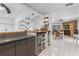 Modern kitchen featuring granite countertops, stainless steel wine cooler, and open floor plan at 6339 Coopers Green Ct, Orlando, FL 32819