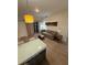 Bright living room featuring modern furnishings, stylish lighting, comfortable seating, and natural light at 7395 Universal Blvd # 104, Orlando, FL 32819