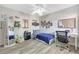 Cozy bedroom featuring wood floors, fan and ample space for a desk at 7781 Sugar Bend Dr # 7781, Orlando, FL 32819