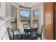 Cozy dining area with a round table, surrounded by windows that offer natural light and views of the outdoors at 7781 Sugar Bend Dr # 7781, Orlando, FL 32819