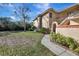 Charming exterior with a well-manicured lawn and inviting entrance at 7781 Sugar Bend Dr # 7781, Orlando, FL 32819