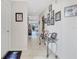 Bright hallway featuring a display table and pictures, creating a warm and inviting transition between spaces at 7781 Sugar Bend Dr # 7781, Orlando, FL 32819