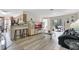 Cozy living room with hardwood floors, connecting to the kitchen and a screened patio, perfect for relaxing or entertaining at 7781 Sugar Bend Dr # 7781, Orlando, FL 32819