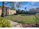 Spacious lawn area with mature trees and well-maintained landscaping at 7781 Sugar Bend Dr # 7781, Orlando, FL 32819