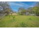 Expansive backyard featuring lush green lawn and ample space for outdoor activities at 818 Alabama Ave, St Cloud, FL 34769