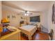 Bedroom with natural light, wood flooring, and neutral wall color scheme at 818 Alabama Ave, St Cloud, FL 34769