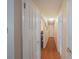 Hallway with hardwood floors and doors leading to rooms at 818 Alabama Ave, St Cloud, FL 34769