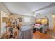 Open living room with a fan, hardwood floors, and several areas for animals at 818 Alabama Ave, St Cloud, FL 34769