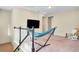 Bonus room with a hammock, plush rocker, and mounted tv at 8321 Bryce Canyon Ave, Windermere, FL 34786