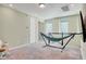 Bonus room with black flatscreen TV and a blue and green hammock at 8321 Bryce Canyon Ave, Windermere, FL 34786