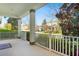 Inviting covered front porch with white railings, providing a charming outdoor space to relax at 8321 Bryce Canyon Ave, Windermere, FL 34786
