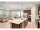 Bright, modern kitchen with a large center island, stainless steel appliances, and an open layout to living room at 8321 Bryce Canyon Ave, Windermere, FL 34786