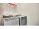 Functional laundry room features side by side washer and dryer set and wire shelving at 8321 Bryce Canyon Ave, Windermere, FL 34786
