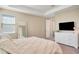 Bright main bedroom features soft lighting, ample natural light, and neutral decor at 8321 Bryce Canyon Ave, Windermere, FL 34786